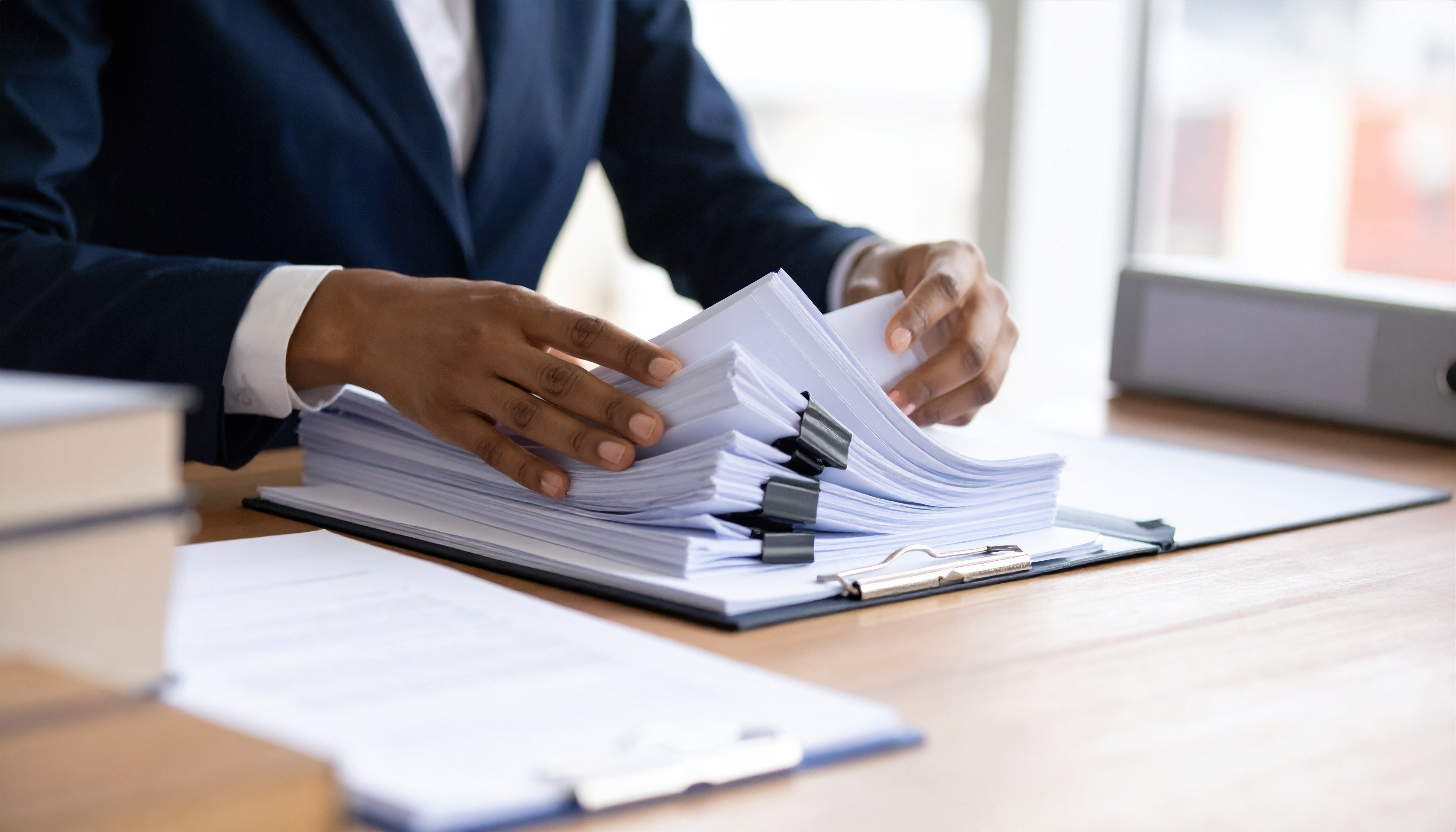 Claims management — professional reviewing project documents